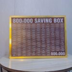wooden 800,000 saving box with target chart