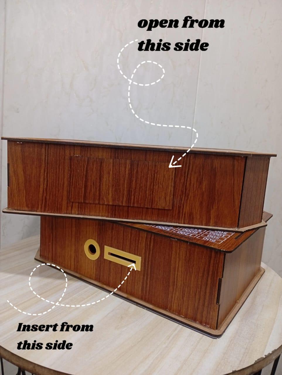 wooden 500,000 pkr saving box with chart