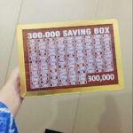 wooden 200,000 rupee saving box with slots