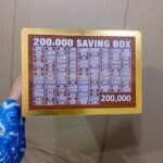 wooden 200,000 rupee saving box with slots